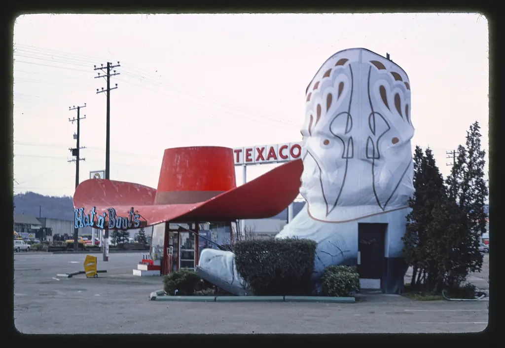 Hat n' Boots gas station (1945), boot restrooms with hat behind them view, 6800 [East] Marginal Way [South], Route 99, Seattle, Washington
